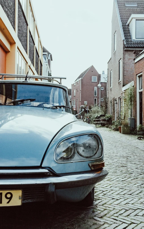 a car parked in front of some brick houses