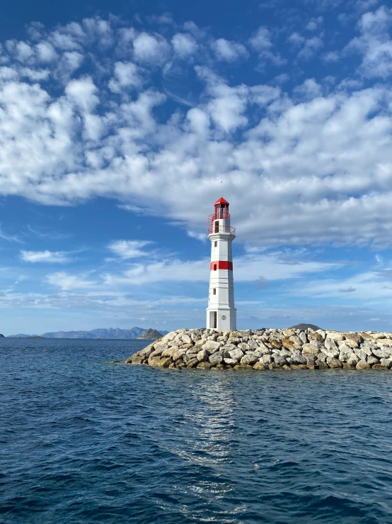 there is a light house by some water