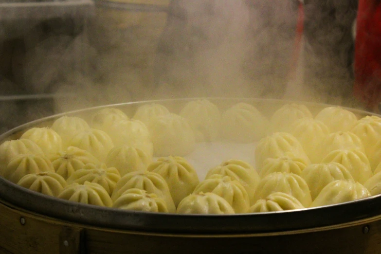 several pasta rolls being cooked in a pot