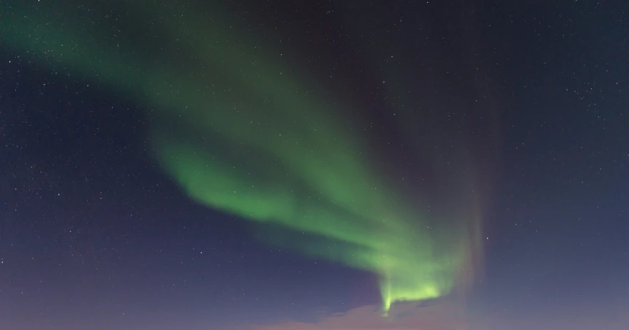 bright green and red aurora aurora is on the horizon