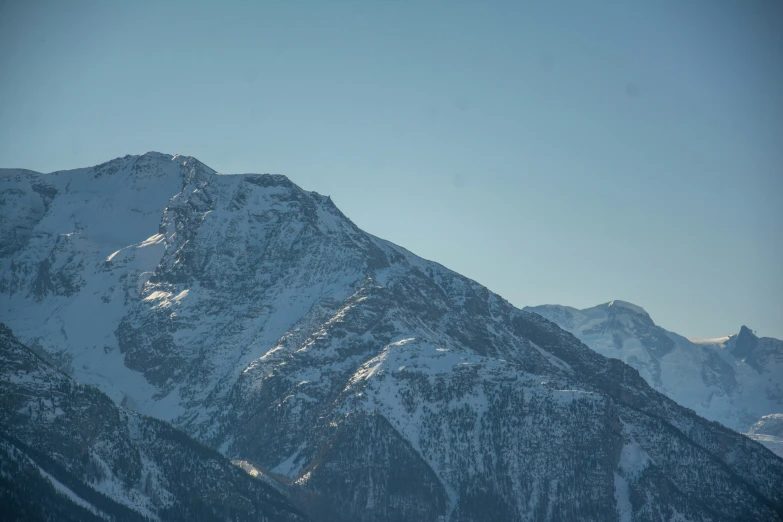 there is snow on the mountains all around