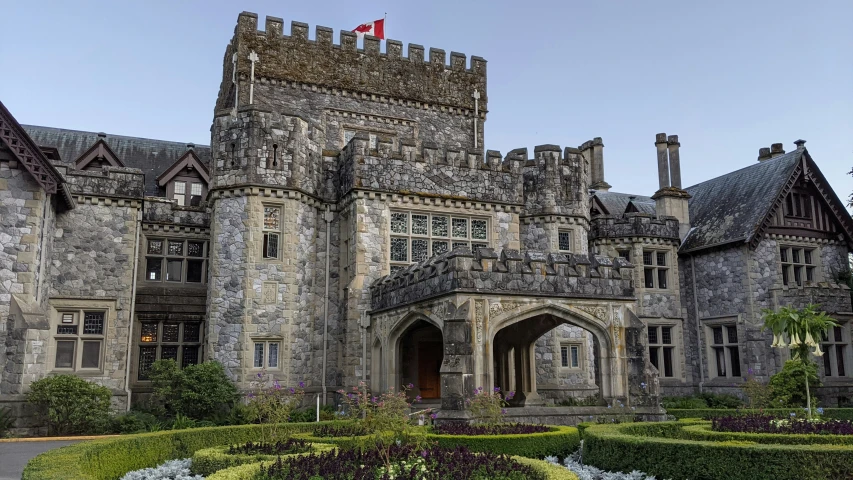 an ornate old castle with a flag on top