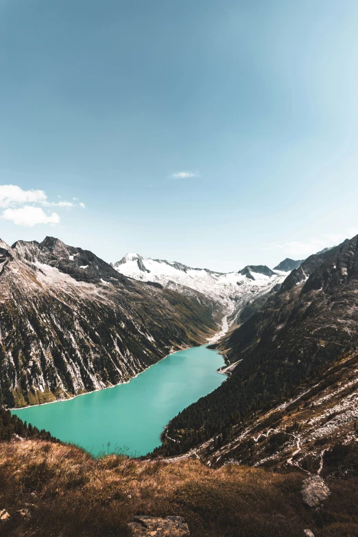 a large body of water is near mountains