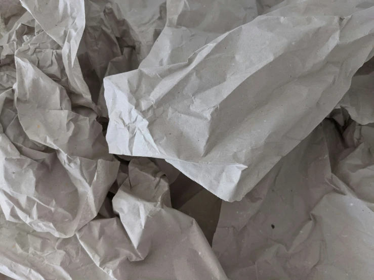 crumpled material sitting on the ground next to each other