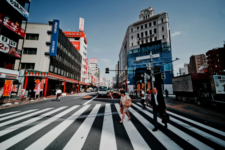 some people and buildings and a street