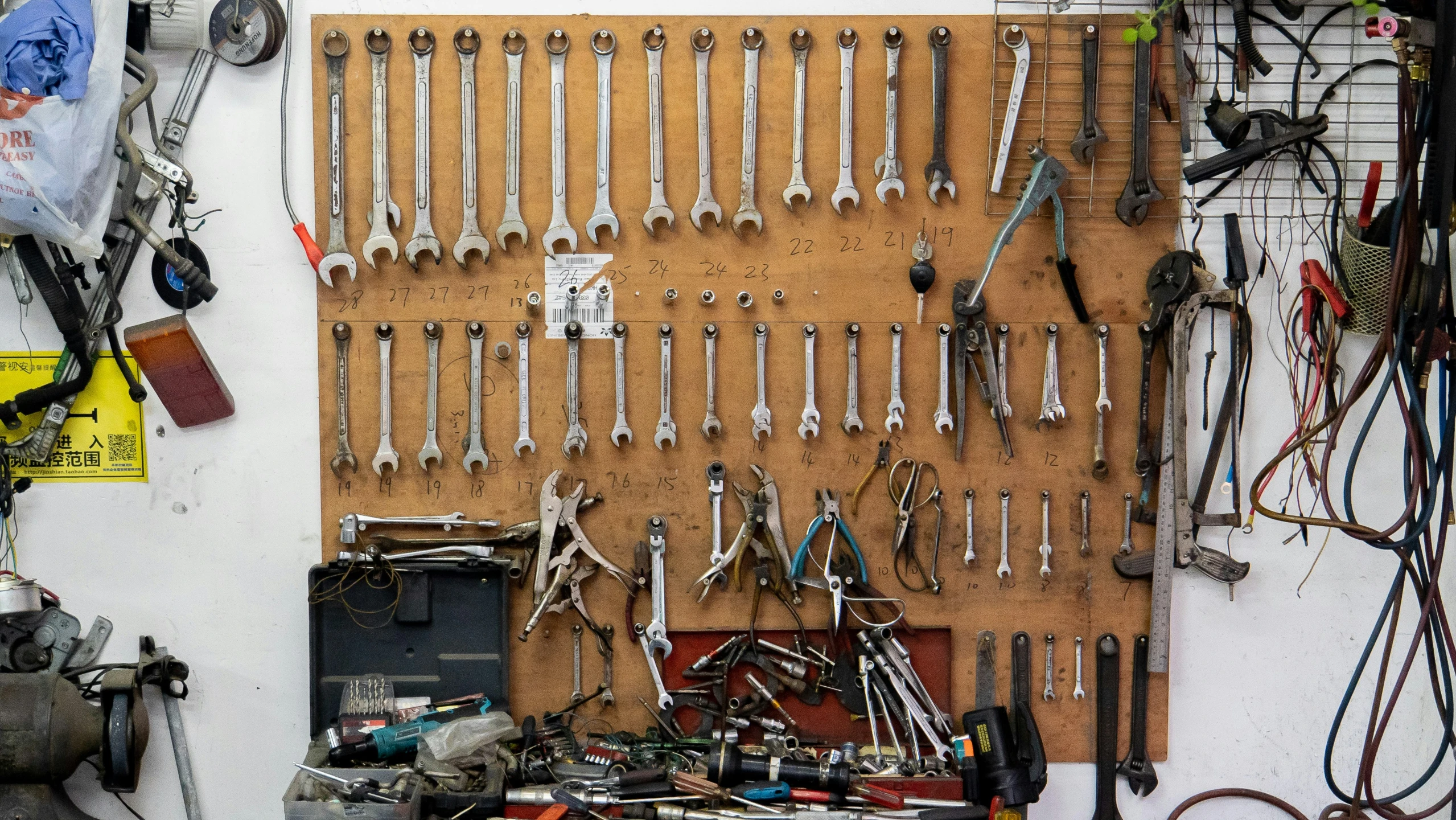 the wall is full of different tools and accessories