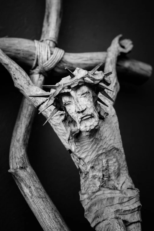 black and white image of jesus  in the form of a cross