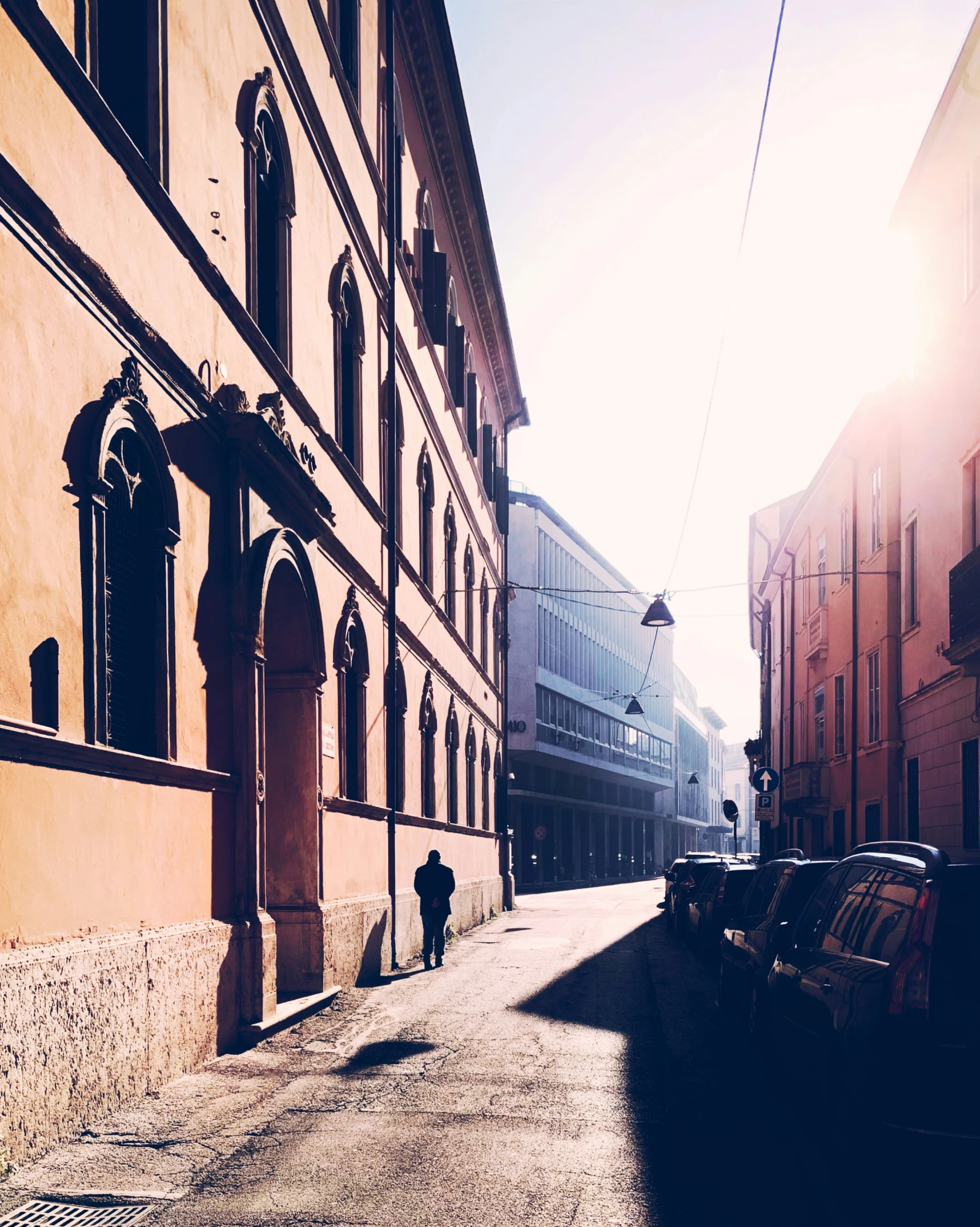 the alley with a parked car is a quiet day