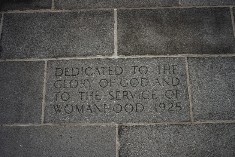 this is a small concrete block with the words dedication to the color of god and the service of wonder
