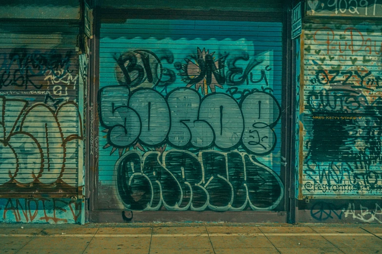 an open door is filled with graffiti on the outside