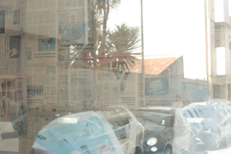 there is a wall covered in newspaper with newspaper clippings