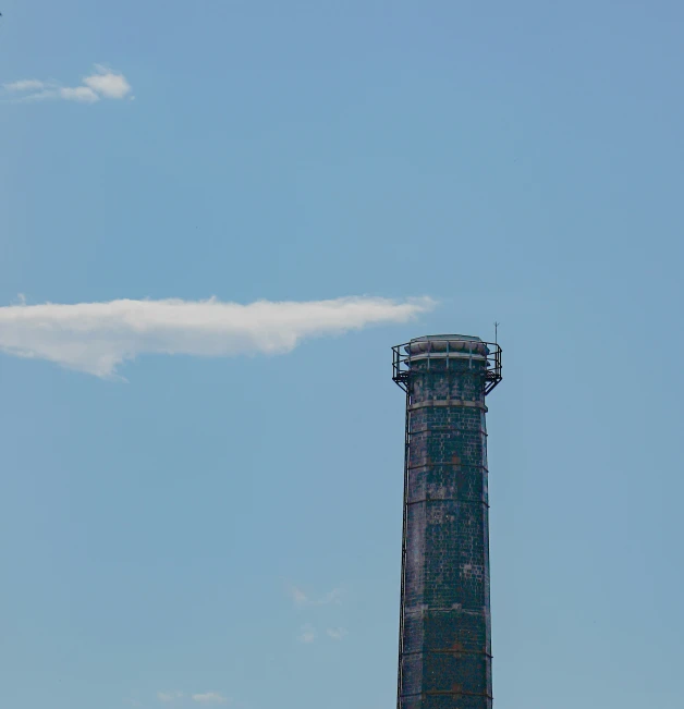 an airplane flying over the top of a tall building