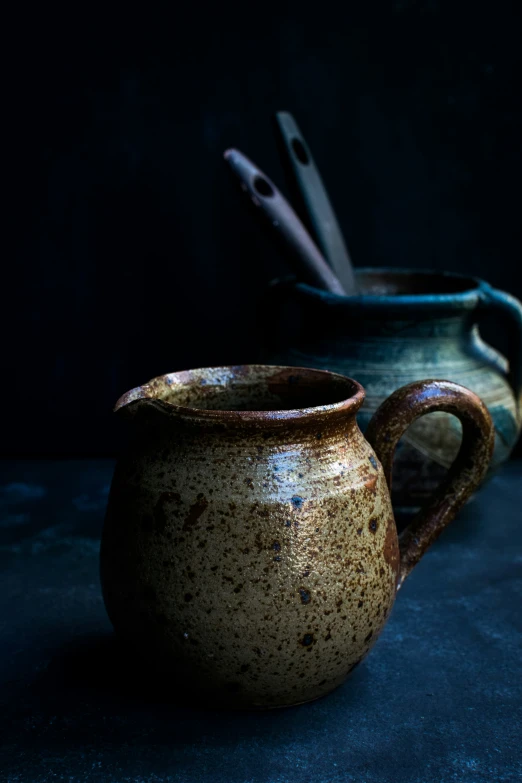 a brown jug sitting on top of a table