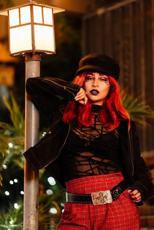 a young lady wearing all black and a hat and jacket