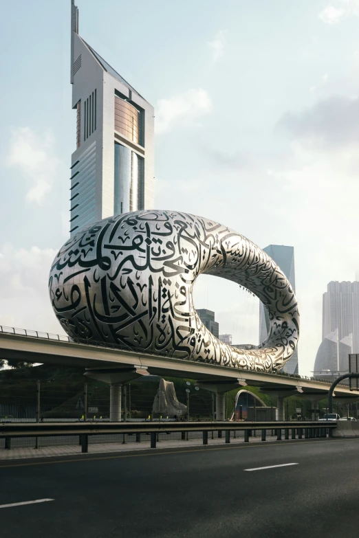 an elephant statue in front of a tall building