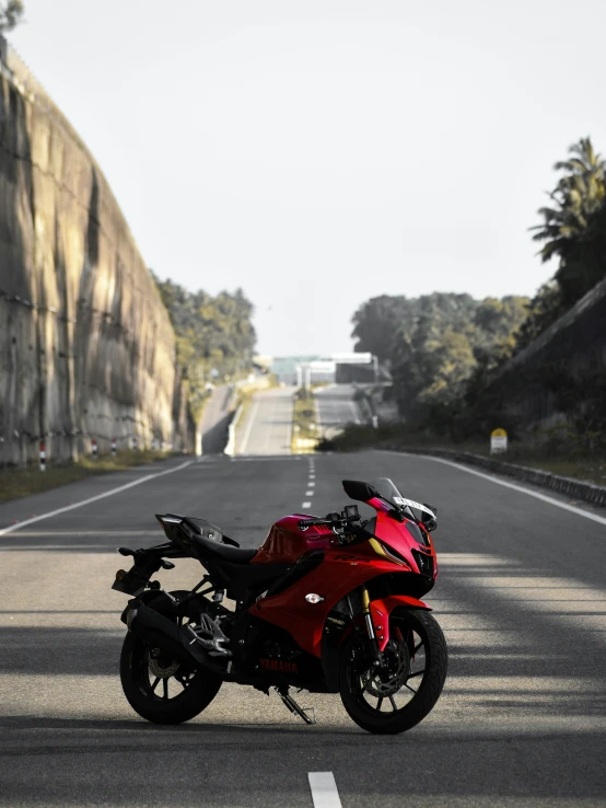 red motorcycle parked in the middle of the street