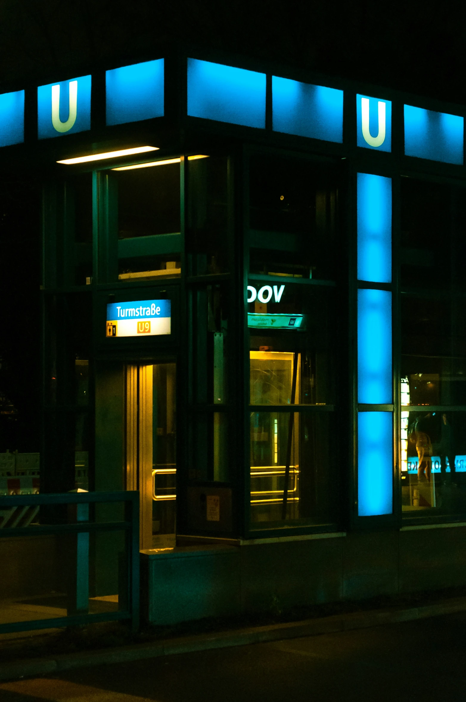 a building at night lit up with blue lights