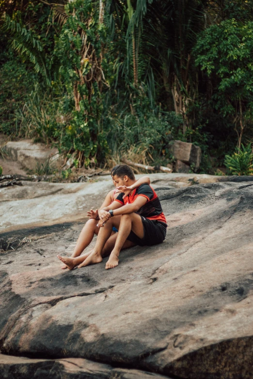 a couple of s that are sitting on rocks