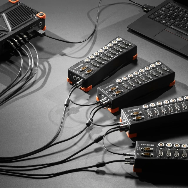 a couple of black and white remotes on a table