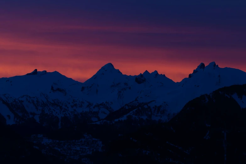 a view of a mountain top during sunset