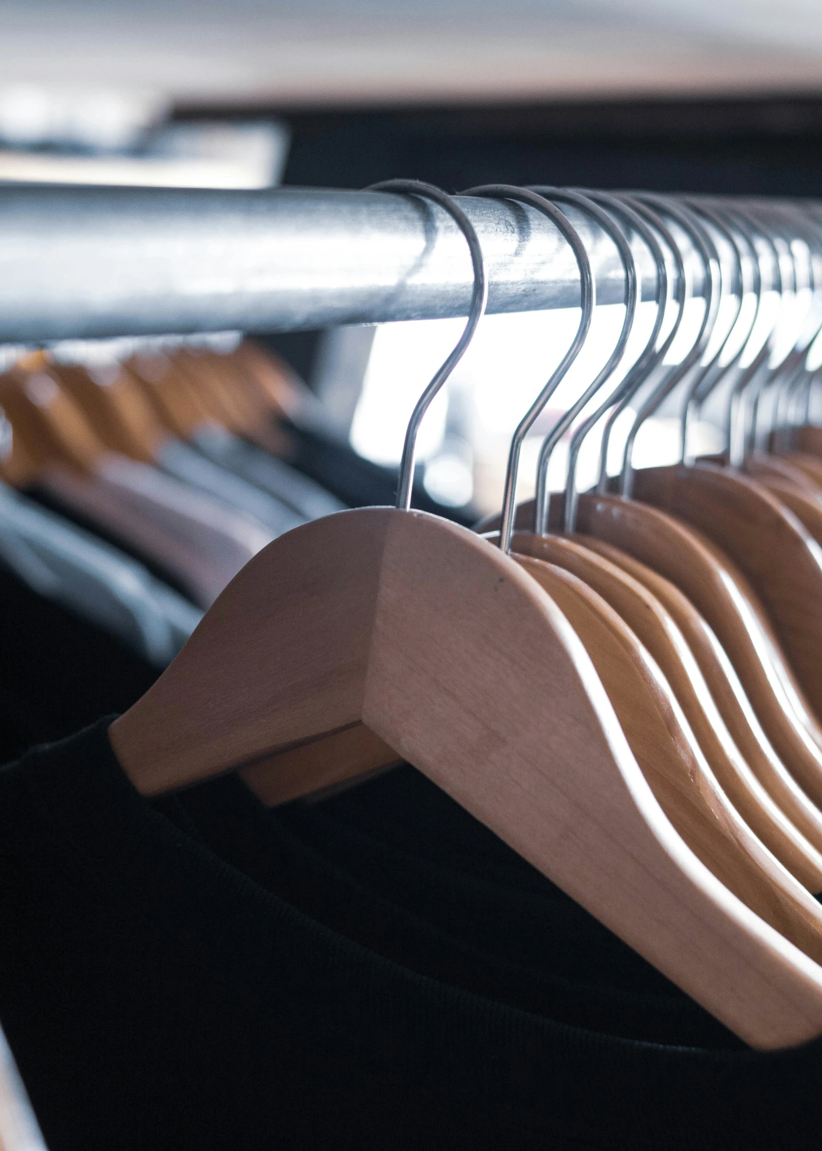 a rack of clothes that are folded on clothes pins