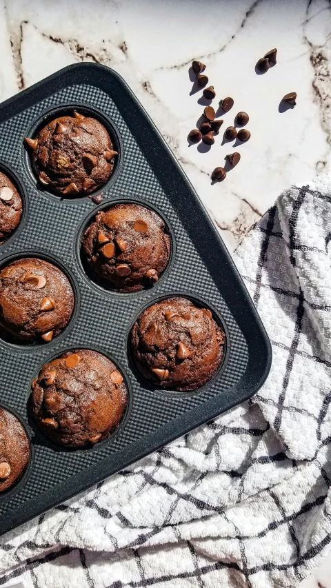 an image of muffins and nuts on a tray