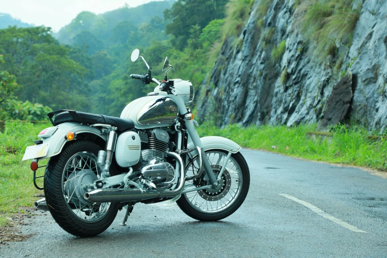 a motorcycle sitting on the side of a rural road