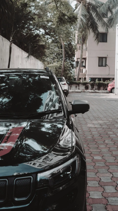 the car is parked along the curb outside