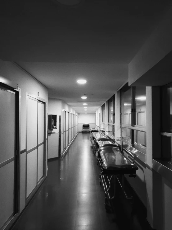 an empty hallway of a building with several doors