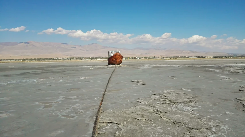 an old vehicle is parked in a deserted area