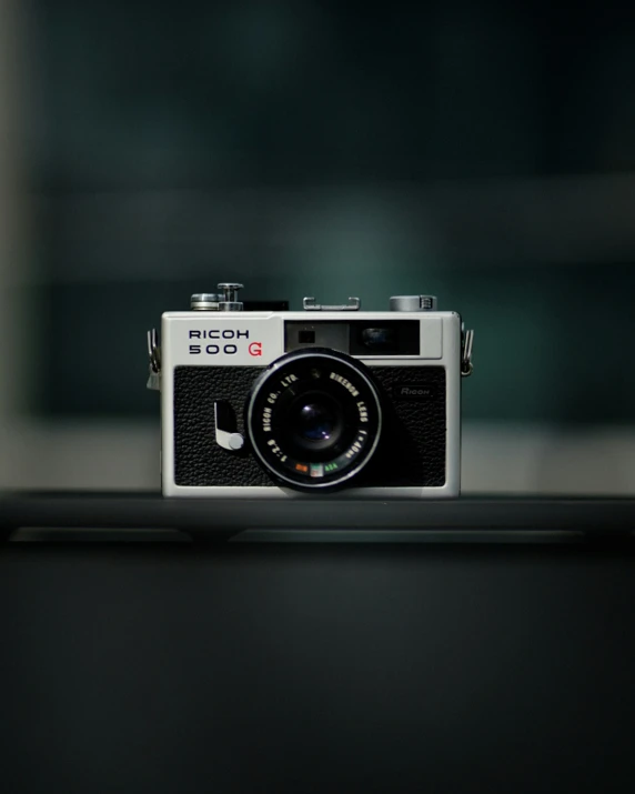 old film camera on top of a desk