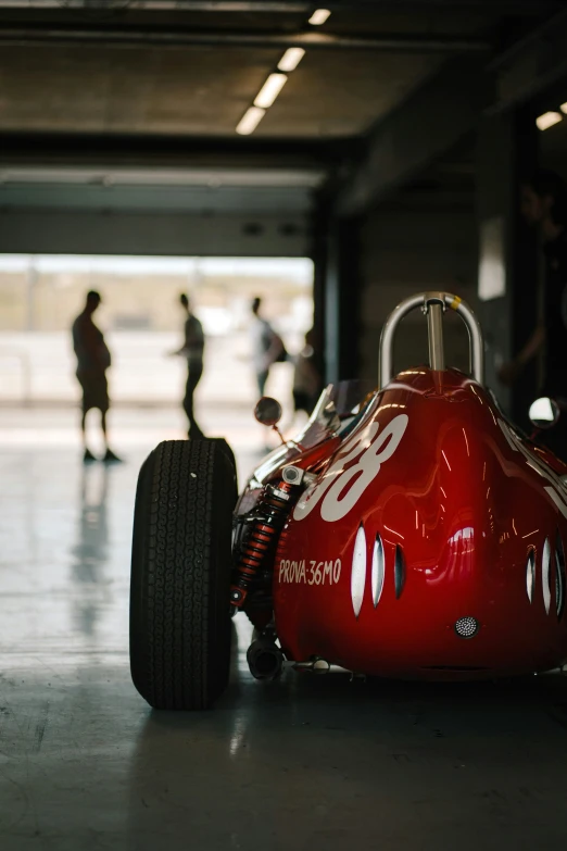 the driver is looking at the car in the garage