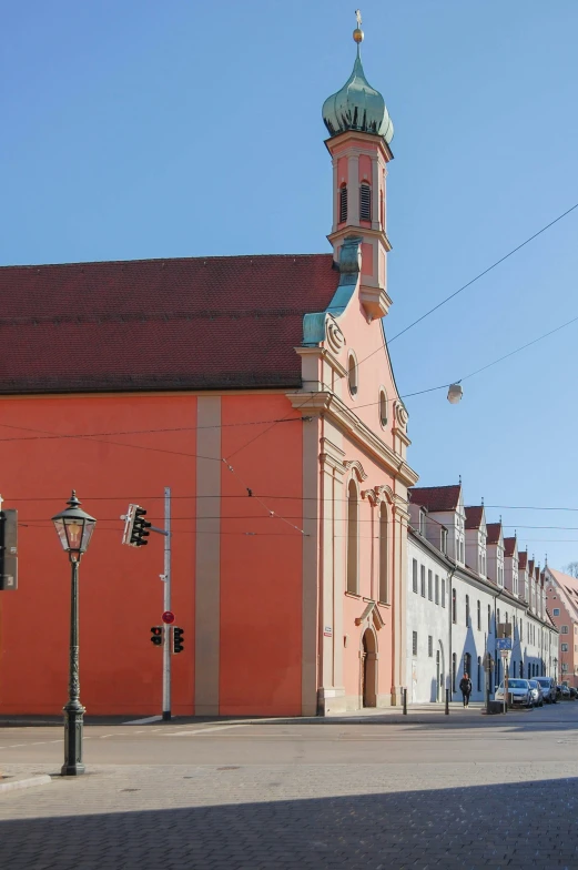 an orange building with a tower that has a clock