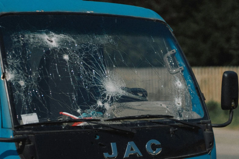 a broken windshield on a vehicle that needs to be repaired