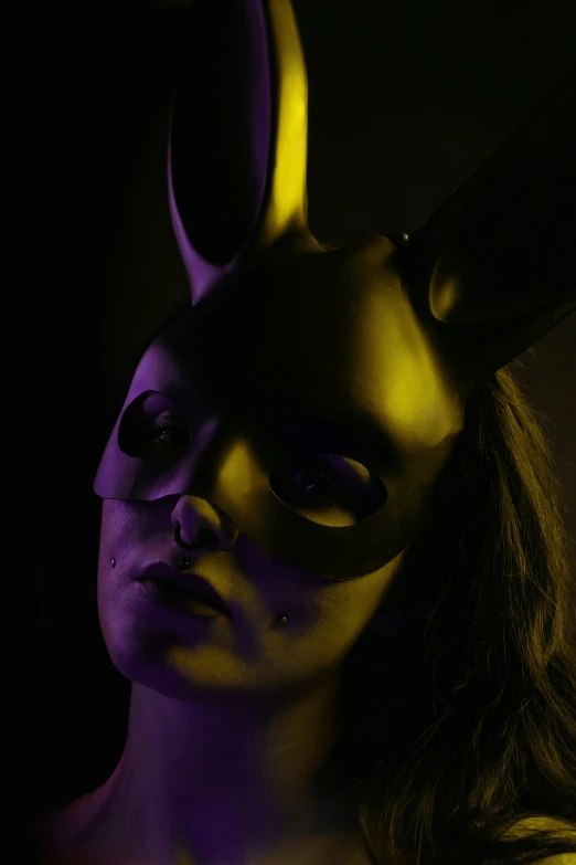 a woman in a mask and bunny ears