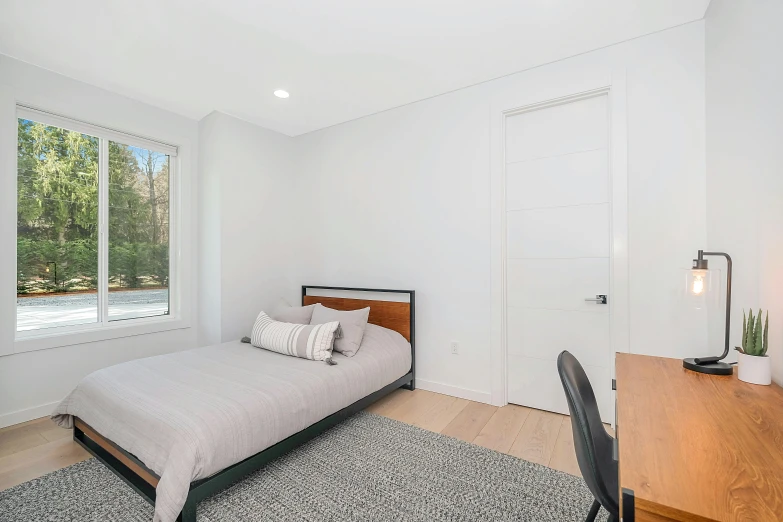 a bedroom with a white walls and light fixtures