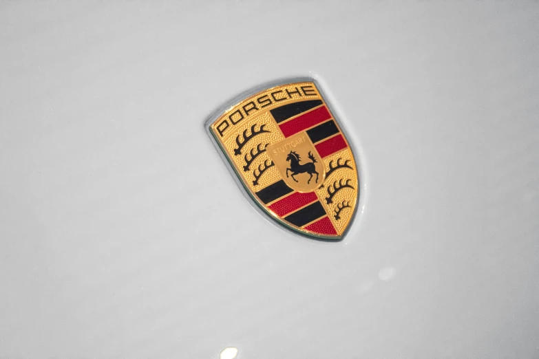 the emblem of a ferrari type car on a surface