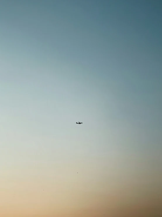 an airplane flying through the sky and it is a jet