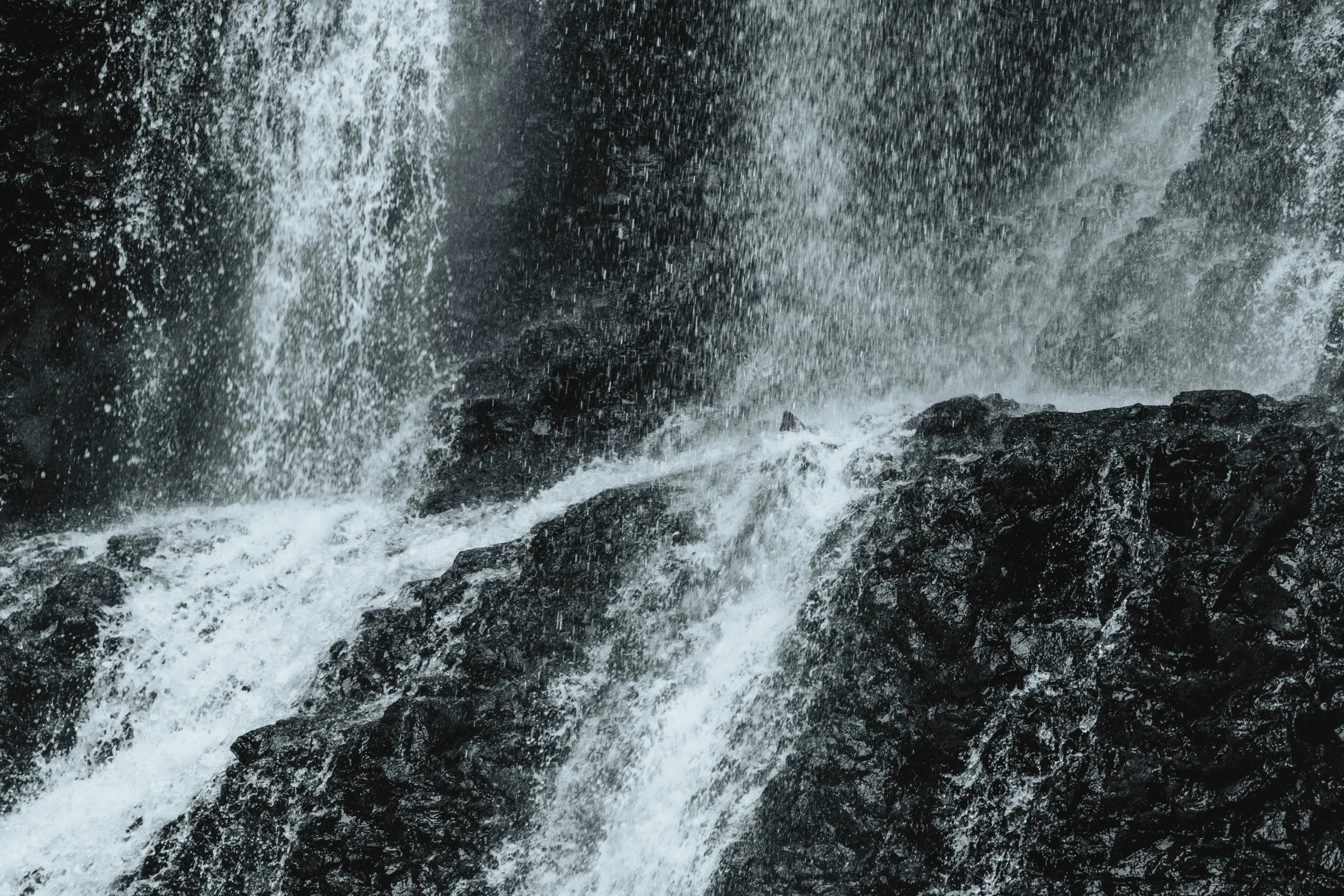 a black and white po of a waterfall