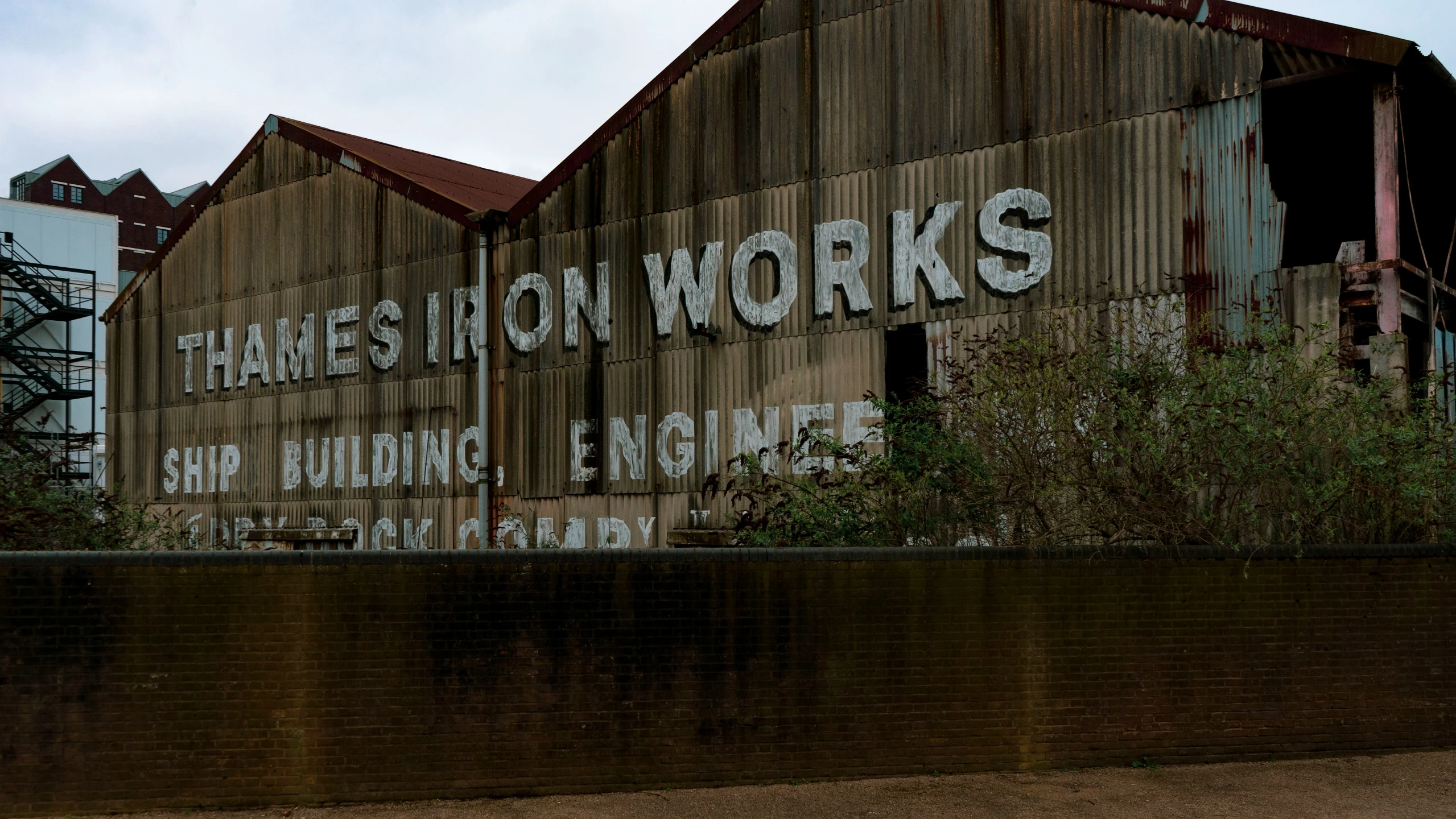 large sign painted on the side of an old building