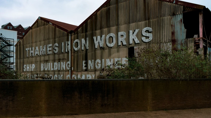 large sign painted on the side of an old building