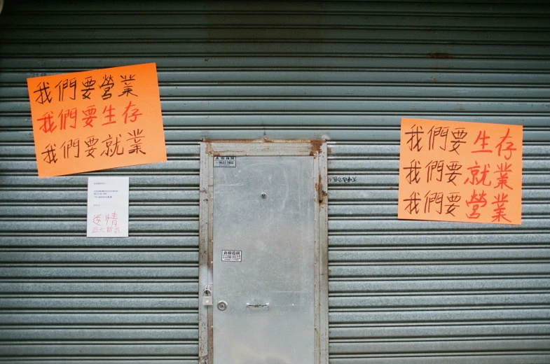 a bunch of orange cards in front of a garage