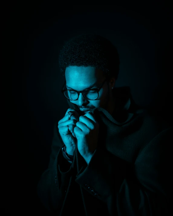 a dark colored pograph of a man holding a microphone