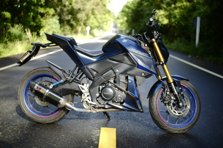 a motorcycle is parked on the side of the road