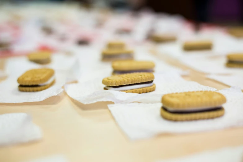 a table with rows of cookies sitting on towels