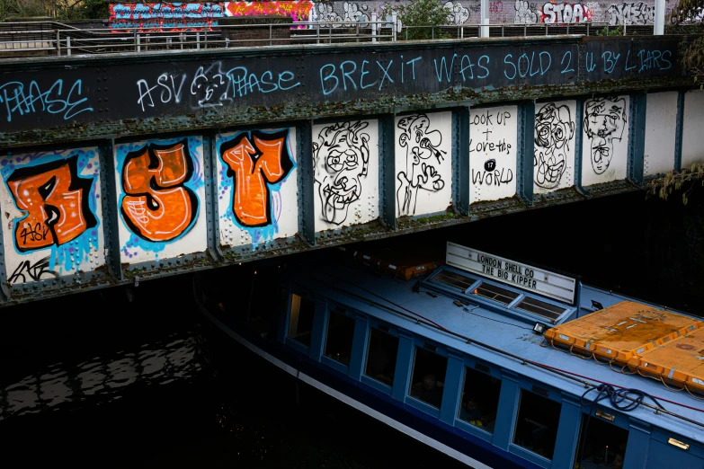 the bottom portion of a boat is covered in grafitti