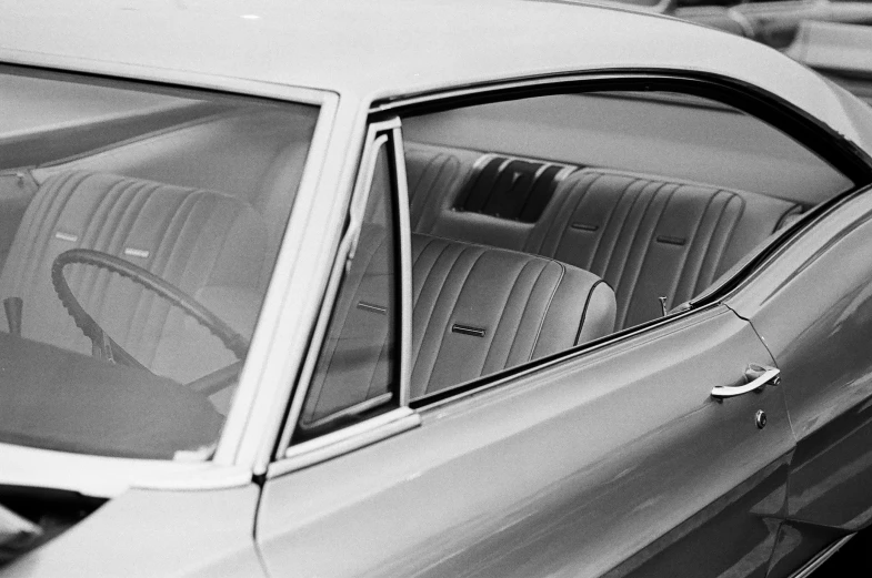 a black and white po of the front seat of a car