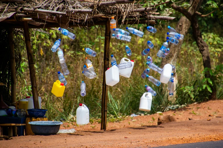 bottles of water hanging on a clothesline outside