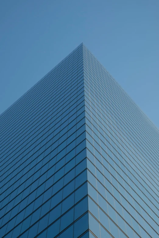 a view up at an unusual building with many windows