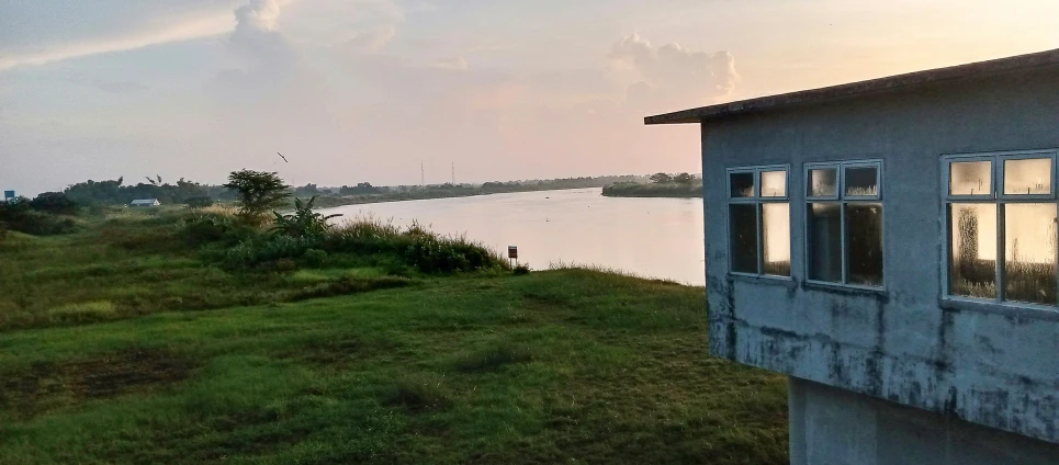 a river runs in front of a house